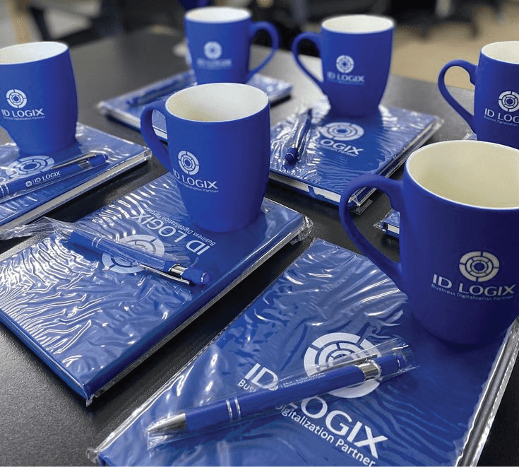 Branded corporate gift set of mugs, notebooks, and pens