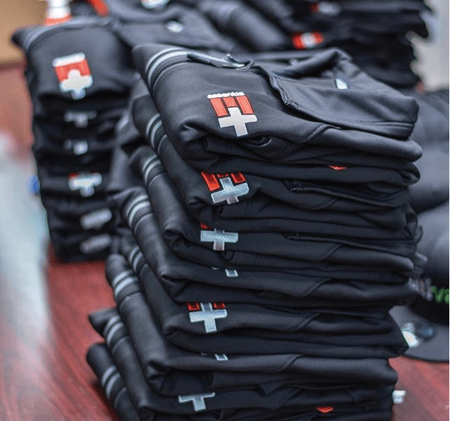 Stack of embroidered branded hoodies